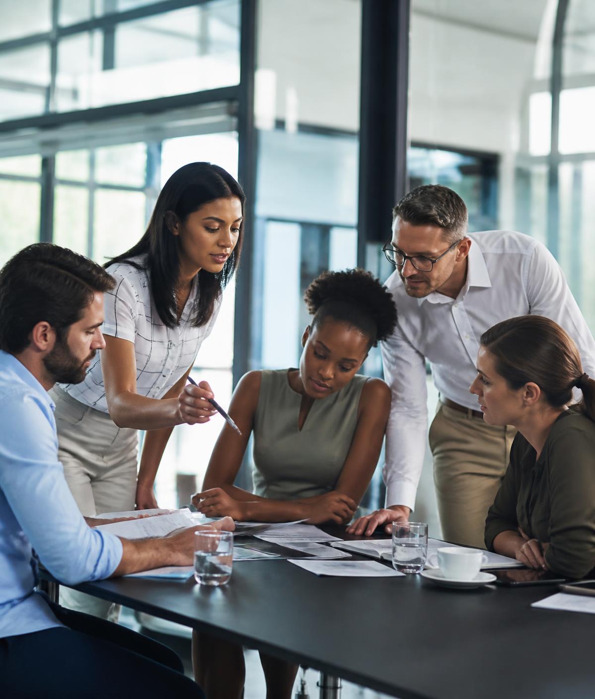 WMA recruiters collaborating with a client team in a modern office